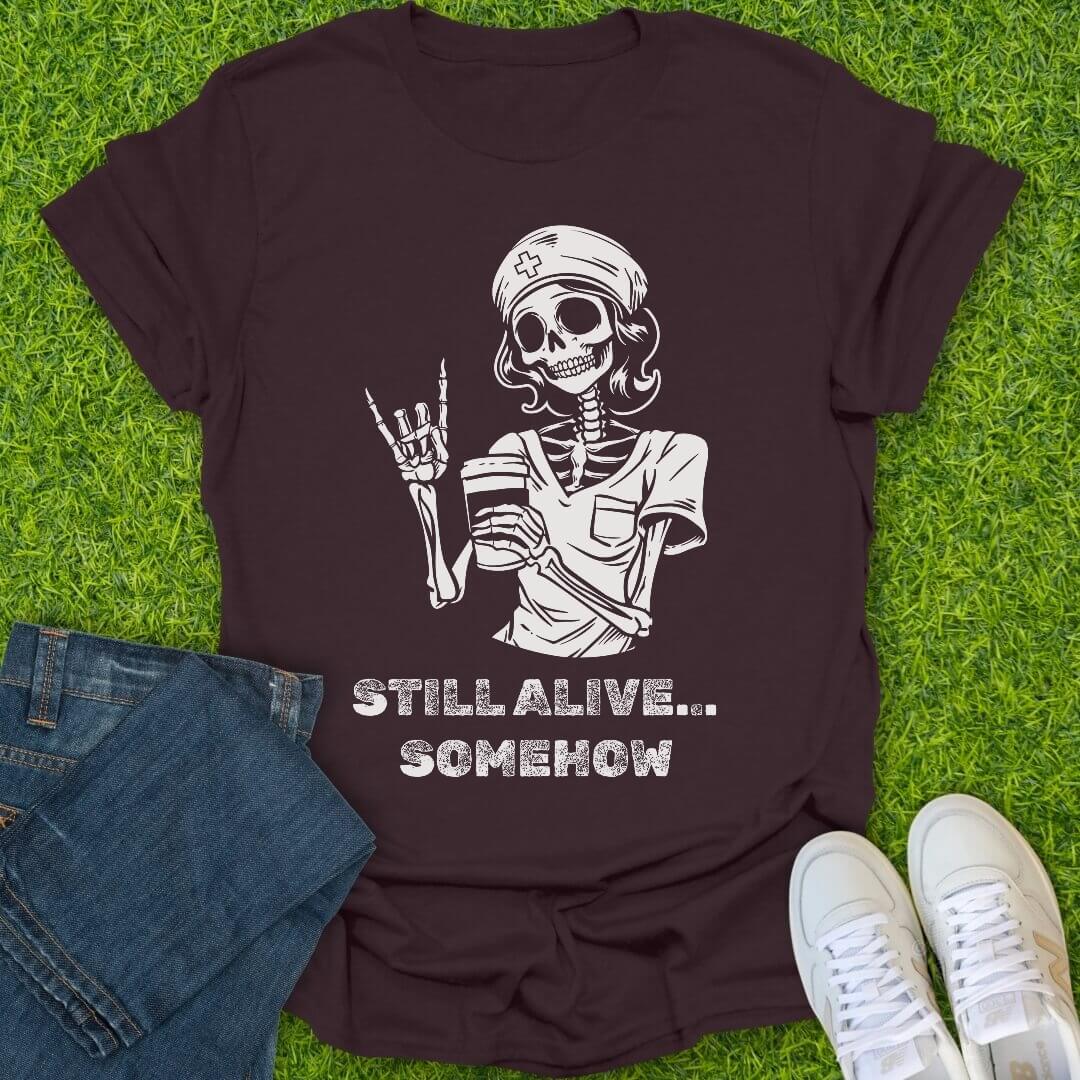 T-Shirt Dark Chocolate / S Still Alive Somehow Tee